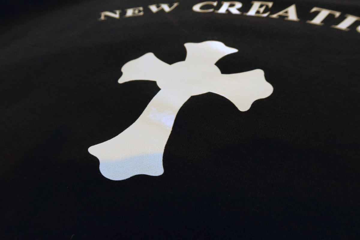 The cross on the back print, close
