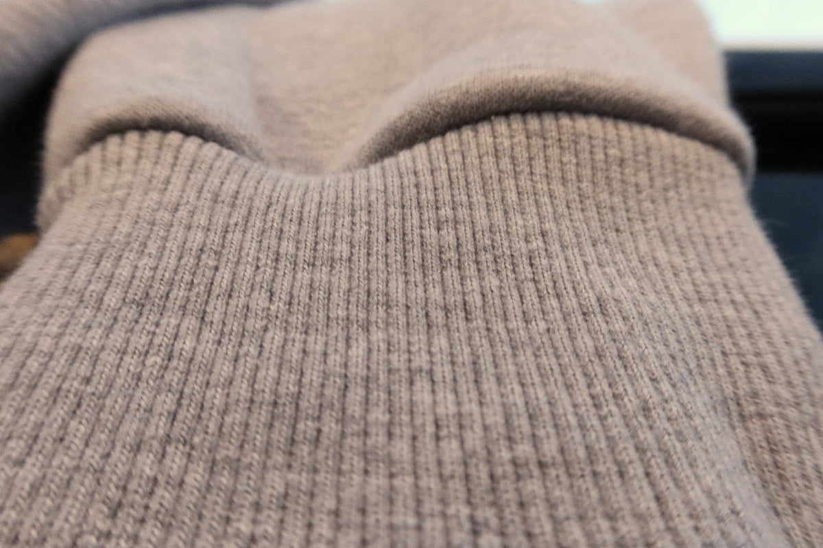 Ribbed cuff on heather grey, close