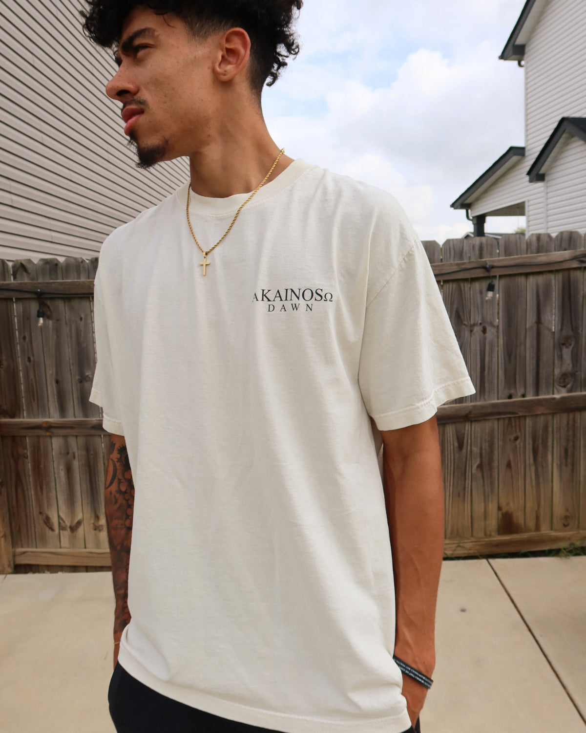 DAWN tee worn, front, with the KAINOS chest lockup