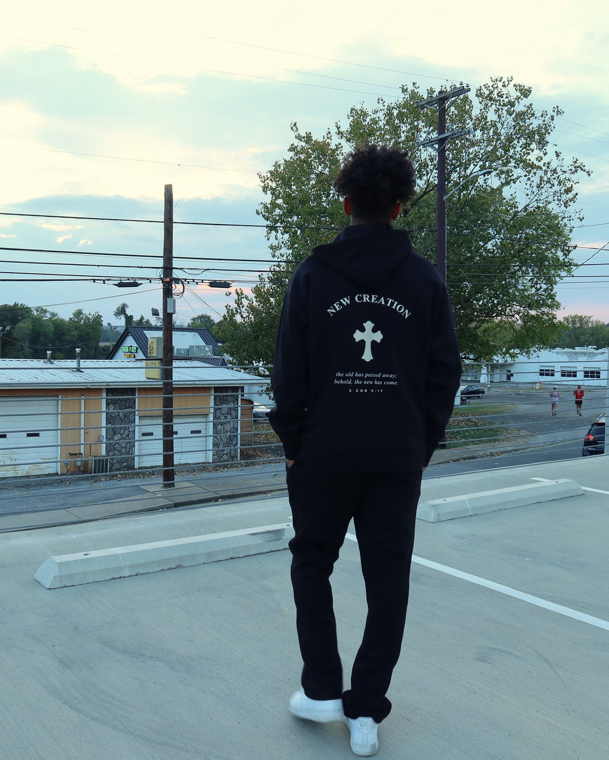 NEW CREATION hoodie in black, worn, back print