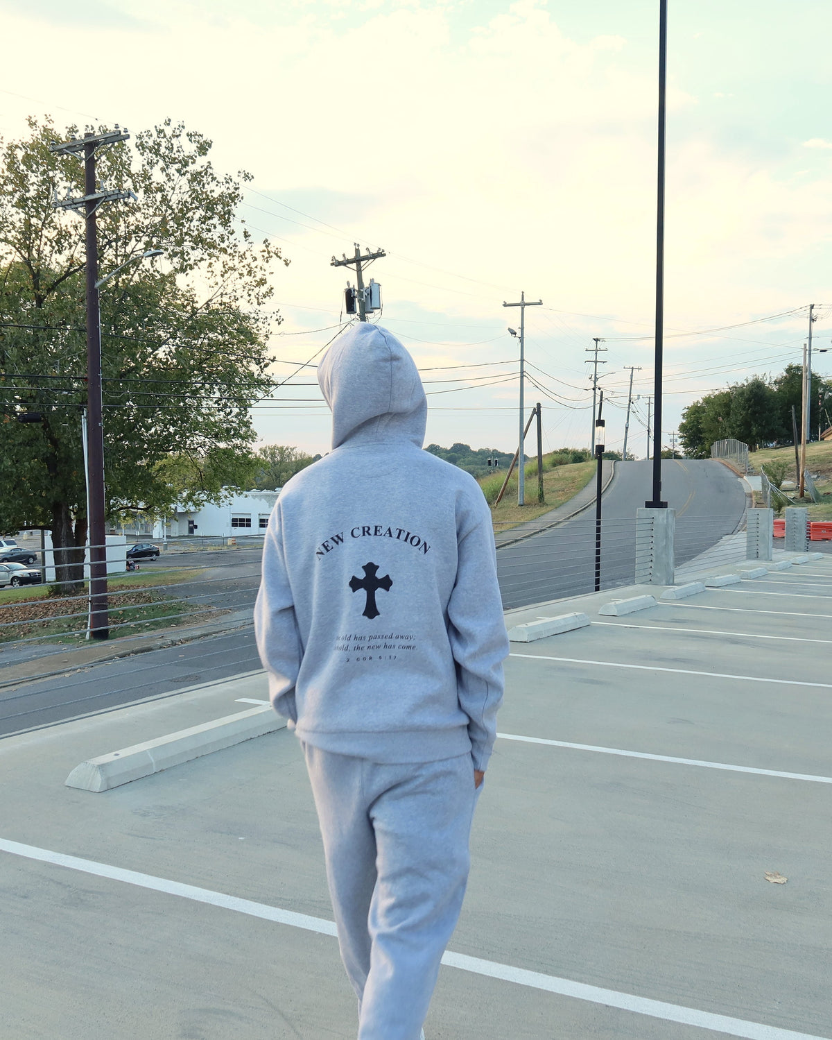 NEW CREATION hoodie in heather grey, hood up, back print