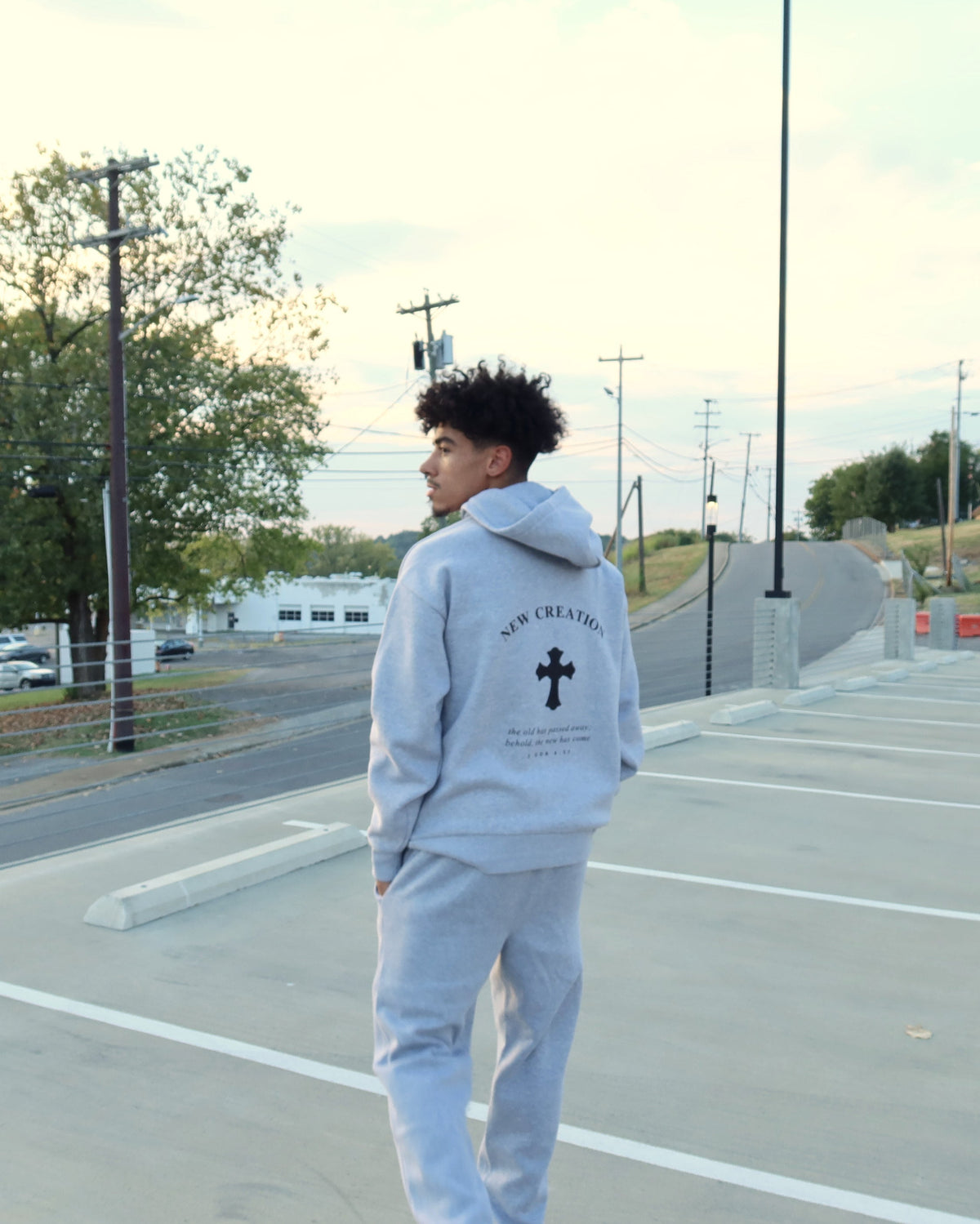 NEW CREATION hoodie in heather grey, back print, three quarter