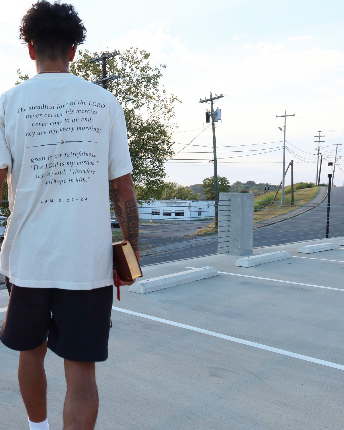 DAWN tee worn, Lam. 3:22–24 across the back