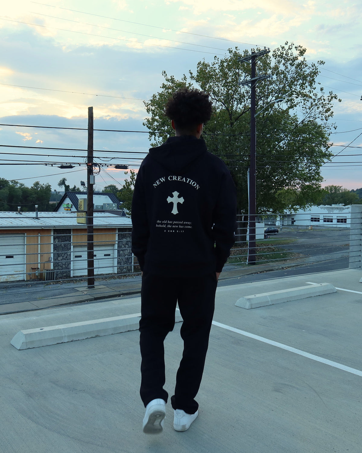 NEW CREATION hoodie in black, back print, walking