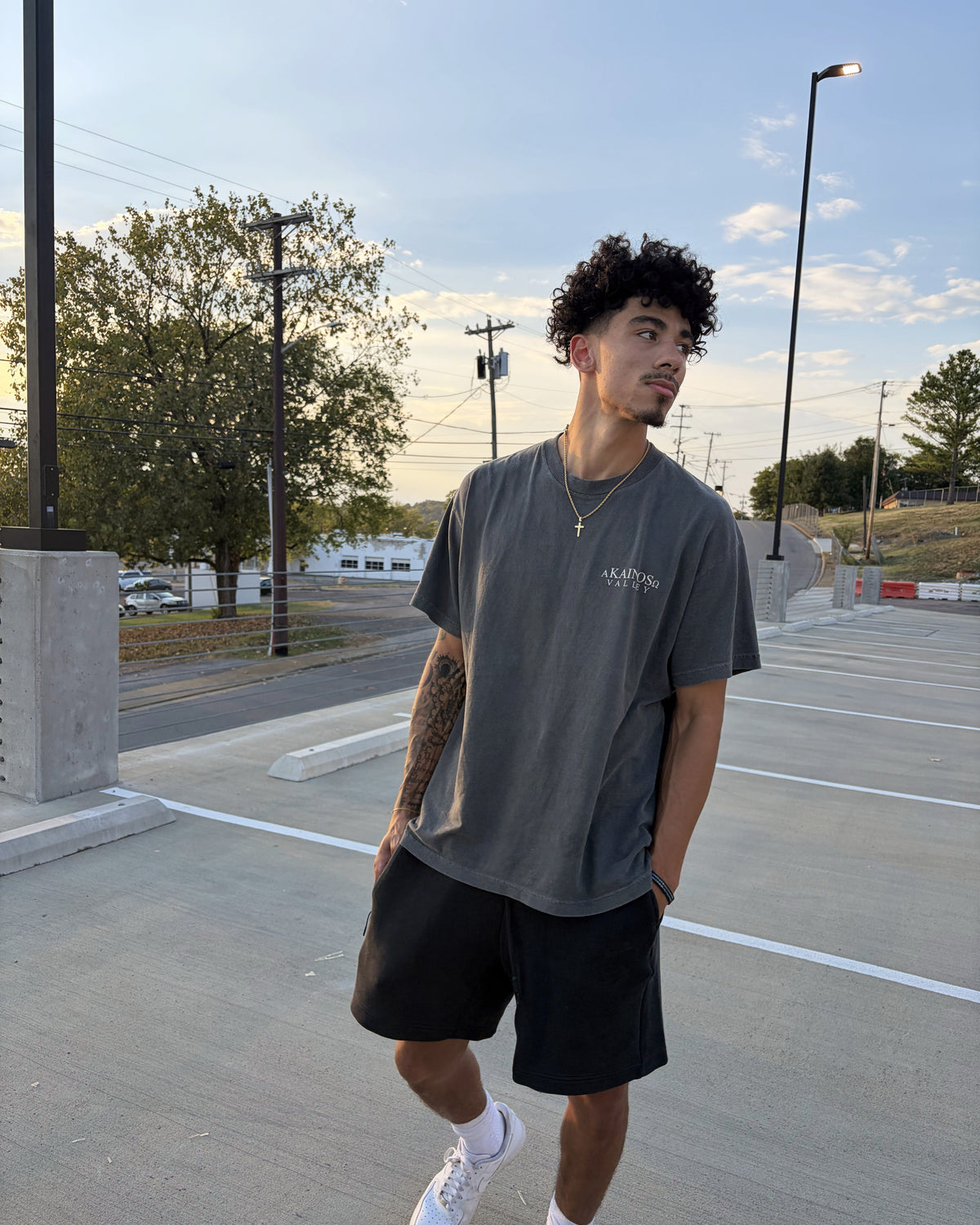 VALLEY tee worn, front, with the KAINOS chest lockup