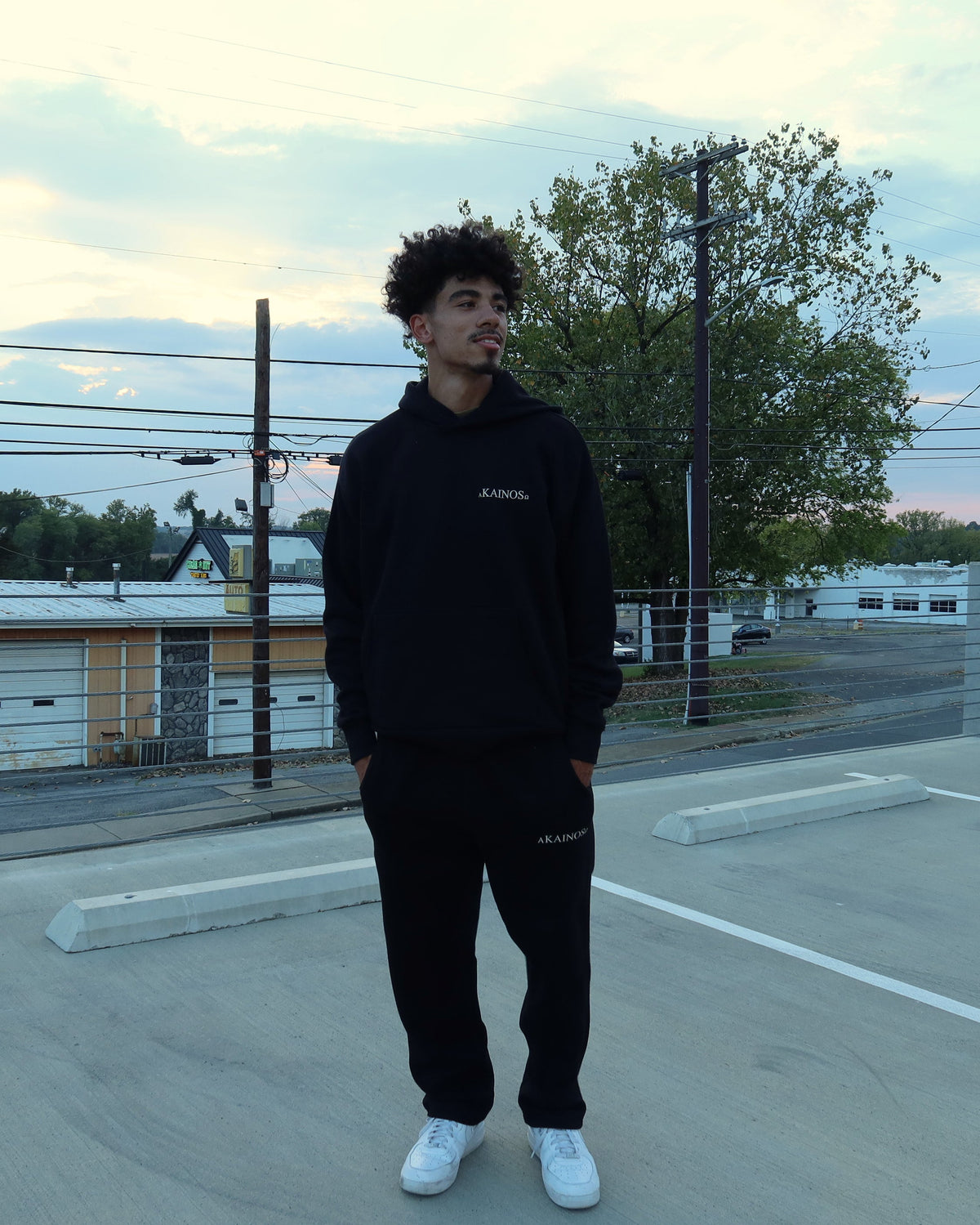 NEW CREATION hoodie in black, worn, front