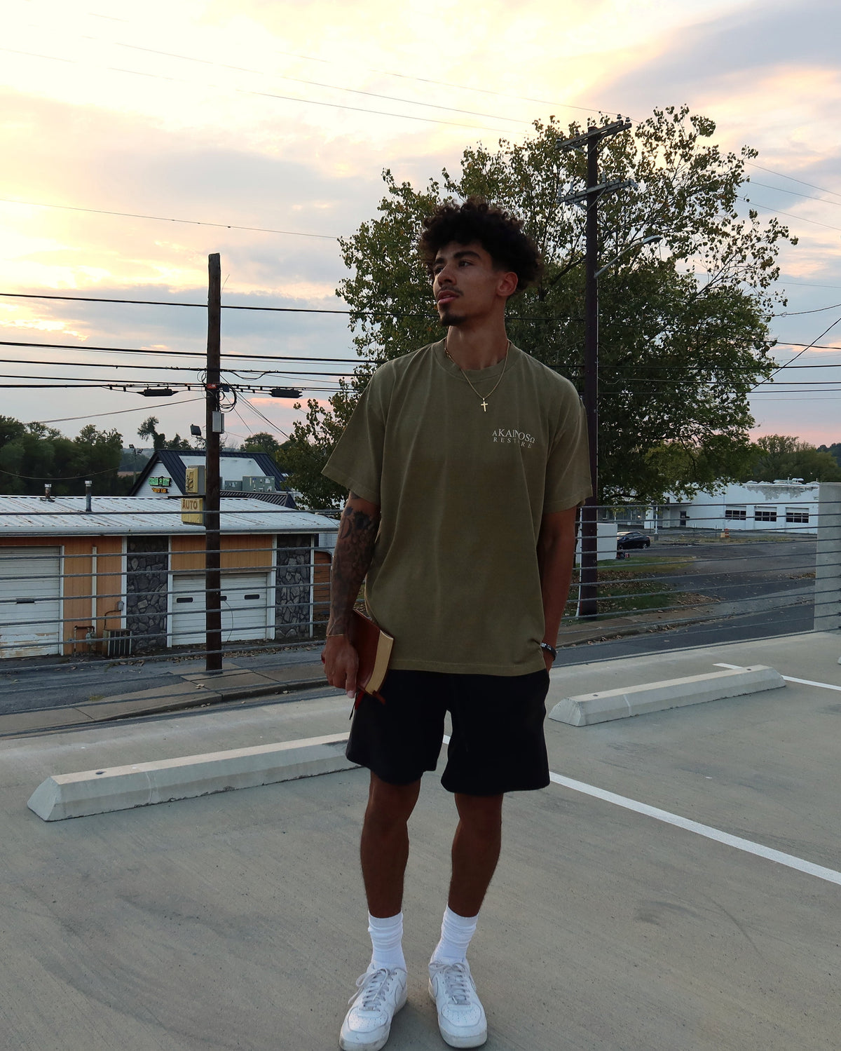 RESTORE tee worn, front at sunset